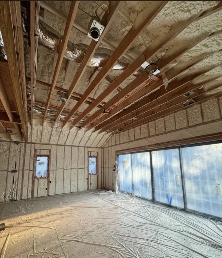 Interior walls and ceiling insulated with spray foam during new construction in Willowbrook